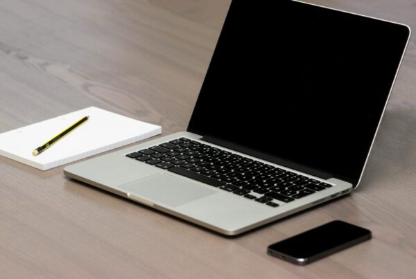 Free Silver Macbook Beside Iphone Stock Photo