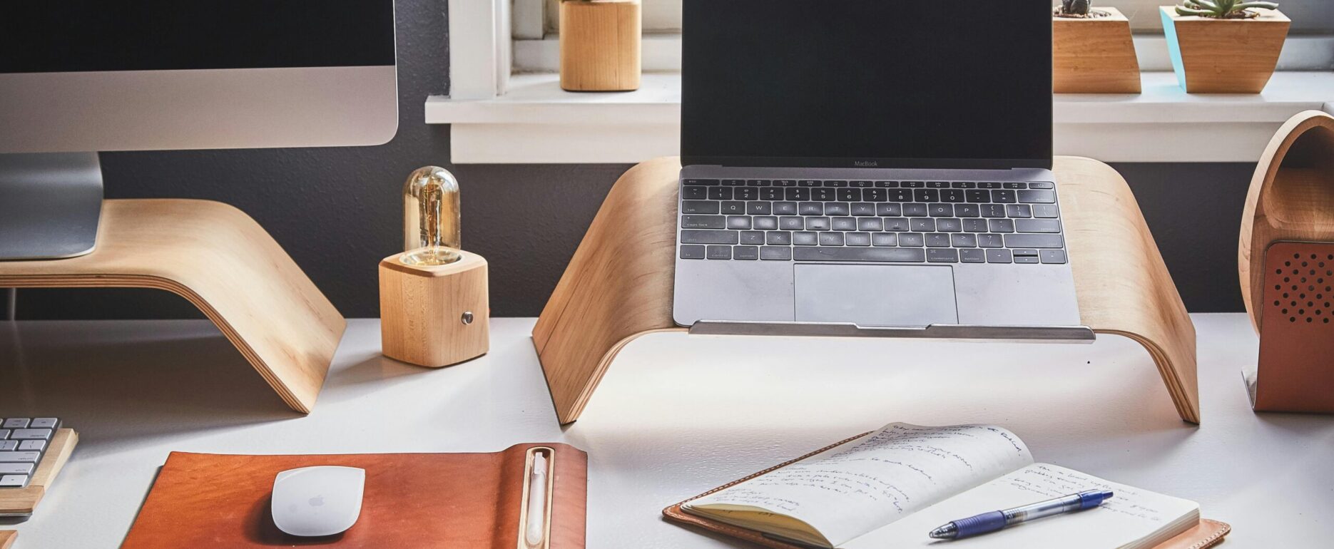 Free A stylish and contemporary home office setup with laptop and desk accessories. Stock Photo